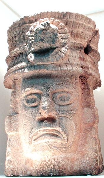 Figure wearing a feathered hat by Mayan